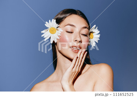 Pure Beauty: Young Woman's Attractive and Sensual Portrait with Flowers, Exuding Freshness and Relaxation on a White Background Pure Beauty: Young Woman's Attractive and Sensual Portrait with Flowers, Exuding Freshness and Relaxation on a White Background 111652525