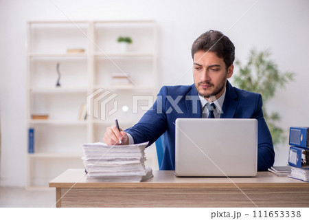 Young male employee working in the office 111653338