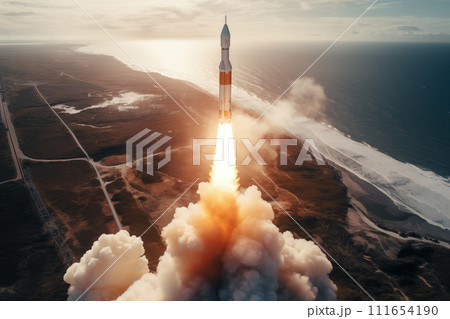 Aerial view of rocket launch at sunrise over ocean coast 111654190