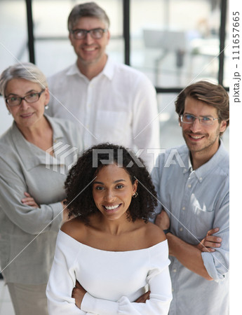 Negotiations in the office. Smiling businesswoman talks with colleagues 111657665