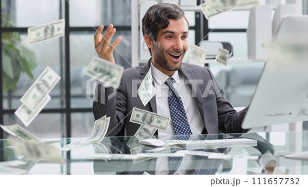 Shocking news. Surprised young man in a suit and tie looking at 111657732