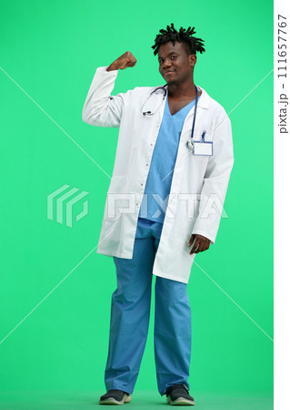 The doctor, in full height, on a green background, shows a call sign 111657767