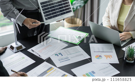 Alternative energy environment business team discuss about solar cell panel and document of project 111658825
