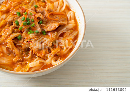 Korean udon ramen noodles with pork in kimchi soup 111658893