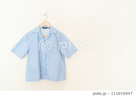 beautiful woman shirt hanging on wall beautiful woman shirt hanging on wall 111658947