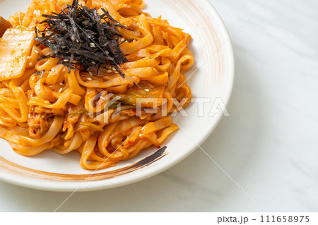 stir-fried udon noodles with kimchi and pork stir-fried udon noodles with kimchi and pork 111658975