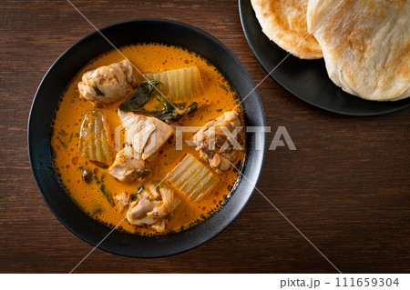 Chicken curry soup with roti Chicken curry soup with roti 111659304