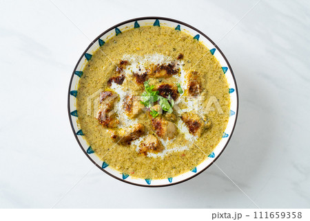 Afghani chicken in green curry or Hariyali tikka chicken hara masala Afghani chicken in green curry or Hariyali tikka chicken hara masala 111659358