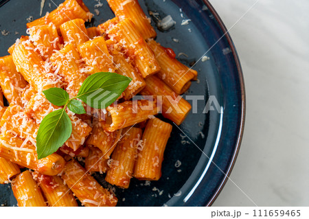 Rigatoni pasta with tomato sauce and cheese Rigatoni pasta with tomato sauce and cheese 111659465