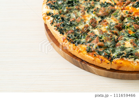 spinach and cheese pizza on wood tray spinach and cheese pizza on wood tray 111659466