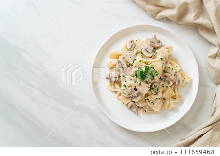 farfalle pasta with mushroom white cream sauce farfalle pasta with mushroom white cream sauce 111659468