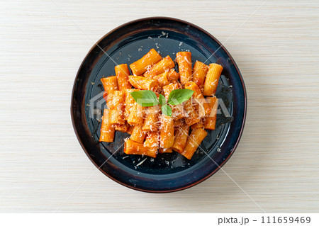 Rigatoni pasta with tomato sauce and cheese Rigatoni pasta with tomato sauce and cheese 111659469