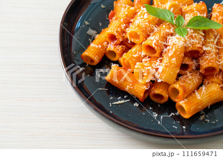Rigatoni pasta with tomato sauce and cheese Rigatoni pasta with tomato sauce and cheese 111659471