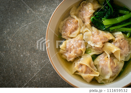 pork wonton soup or pork dumplings soup with vegetable 111659532