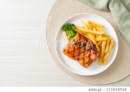 grilled chicken steak with potato chips or french fries 111659549