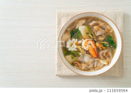 Wide Rice Noodles with Seafood in Gravy Sauce Wide Rice Noodles with Seafood in Gravy Sauce 111659564