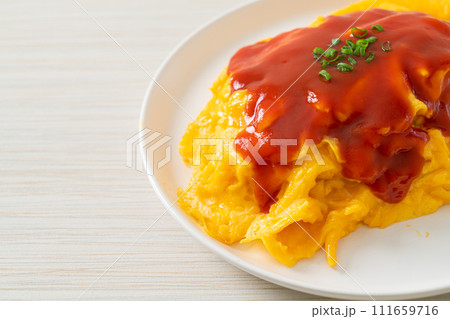 Flavored Fried Rice in an Omelet Wrapping Flavored Fried Rice in an Omelet Wrapping 111659716