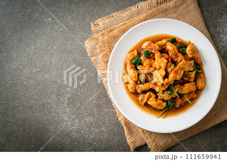 stir-fried fried fish with basil and chili in thai style stir-fried fried fish with basil and chili in thai style 111659941