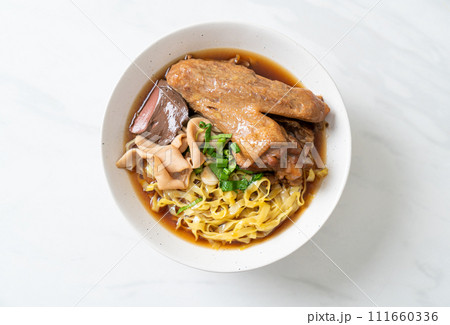 egg noodles with stewed and braised duck in brown soup egg noodles with stewed and braised duck in brown soup 111660336