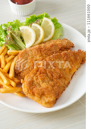 Homemade Breaded Weiner Schnitzel with Potato Chips Homemade Breaded Weiner Schnitzel with Potato Chips 111661000