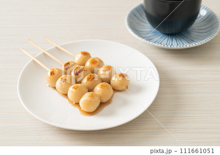 Mitarashi dango. Dumpling in a sweet soy sauce 111661051