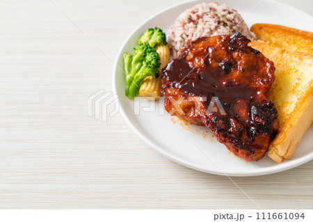 barbecue pork steak with rice berry 111661094