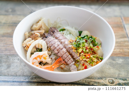 spicy seafood noodles bowl in Thai style 111661275