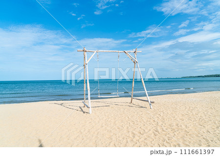 wooden swing on the beach wooden swing on the beach 111661397
