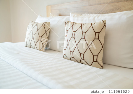 comfortable pillows decorate on bed 111661629