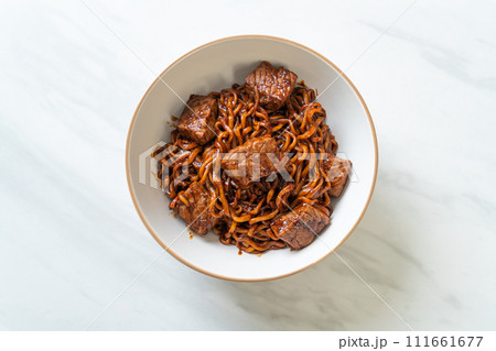 Jjapaguri or Chapaguri, Korean Black Beans Spicy Noodles with Beef 111661677