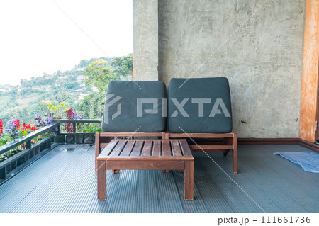 chair on balcony with mountain hill background 111661736