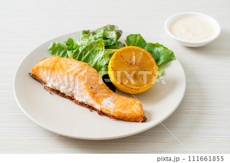 fried salmon steak with lemon and vegetable fried salmon steak with lemon and vegetable 111661855