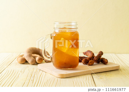 Delicious sweet drink tamarind juice and ice cube 111661977