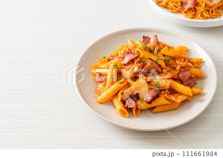 stir-fried penne pasta with kimchi and bacon stir-fried penne pasta with kimchi and bacon 111661984