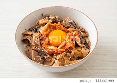 pork bulgogi rice bowl with kimchi and Korean pickled egg 111661994