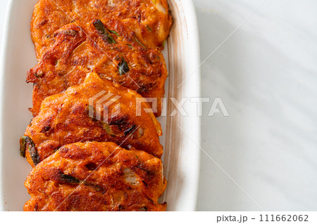 Korean Kimchi pancake or Kimchijeon - Fried Mixed Egg, Kimchi, and Flour 111662062