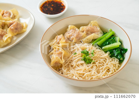 egg noodles with pork wonton soup or pork dumplings soup and vegetable egg noodles with pork wonton soup or pork dumplings soup and vegetable 111662070