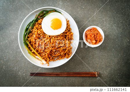 dried Korean spicy instant noodles with fried egg 111662141
