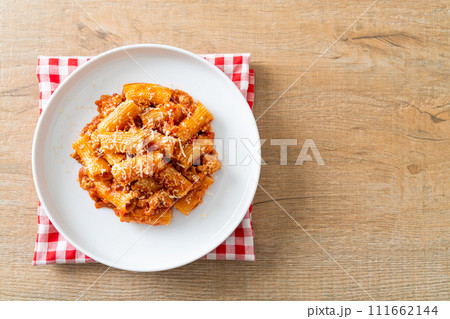 Rigatoni pasta bolognese with cheese 111662144