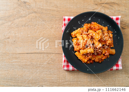 Rigatoni pasta bolognese with cheese Rigatoni pasta bolognese with cheese 111662146