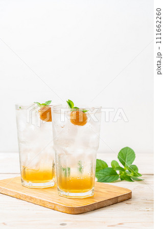 iced plum juice with soda and peppermint 111662260