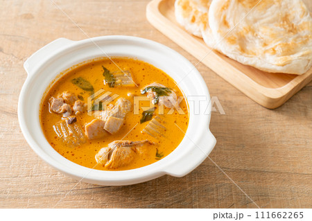 Chicken curry soup with roti Chicken curry soup with roti 111662265
