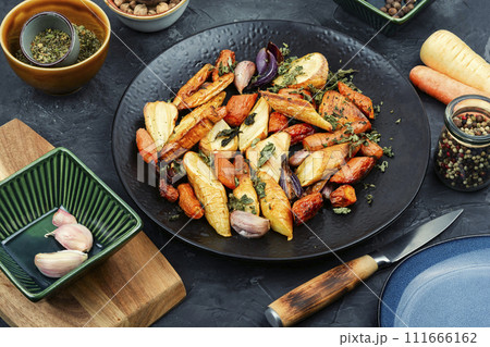 Roasted parsnip root and carrots. Roasted parsnip root and carrots. 111666162