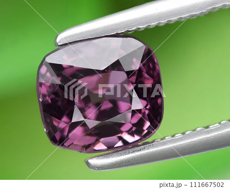 natural purple spinel gem on the background 111667502