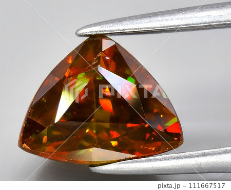 natural brown sphene titanite gem on the background natural brown sphene titanite gem on the background 111667517