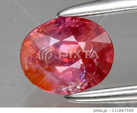 natural orange padparadscha sapphire gem on the background natural orange padparadscha sapphire gem on the background 111667569