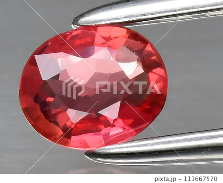 natural orange padparadscha sapphire gem on the background natural orange padparadscha sapphire gem on the background 111667570
