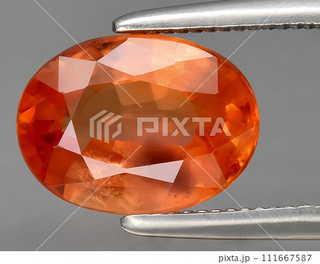 natural orange padparadscha sapphire gem on the background natural orange padparadscha sapphire gem on the background 111667587