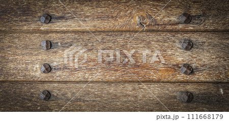 Old boards and metal rivets. Backgrounds and textures Old boards and metal rivets. Backgrounds and textures 111668179