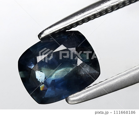 natural green blue sapphire gem on the background natural green blue sapphire gem on the background 111668186